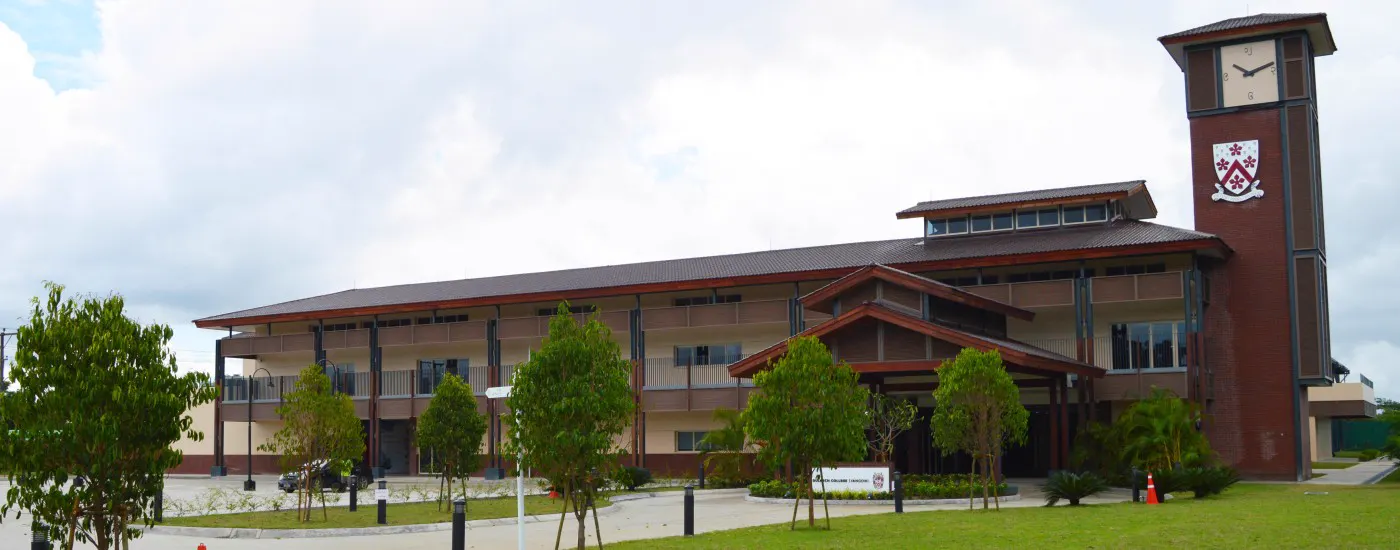 The Dulwich College Yangon campus building with its clock tower and crest