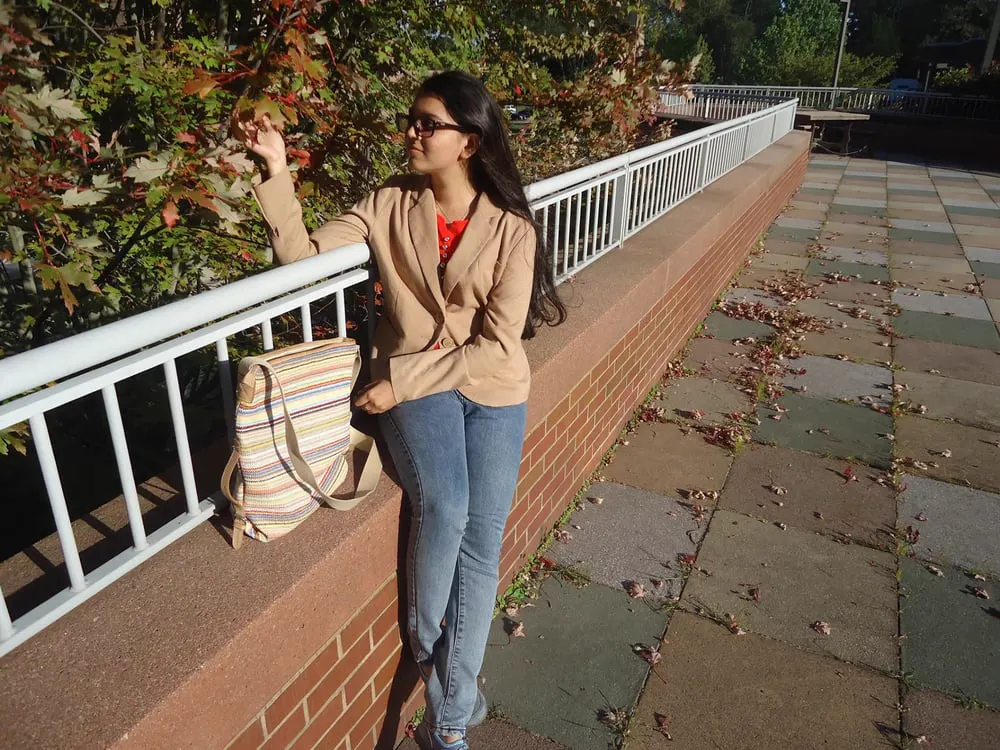 Ruby Yadanar outdoors on a university campus in autumn